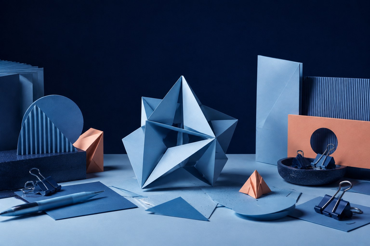 Set up a reversible paper-building challenge.